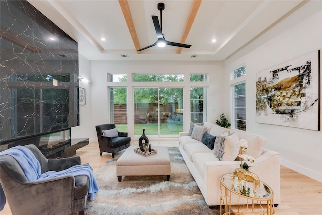 living room with a ceiling fan, recessed lighting, wood finished floors, and visible vents