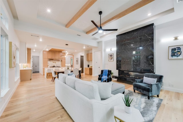 living room with visible vents, beam ceiling, ceiling fan, recessed lighting, and light wood finished floors