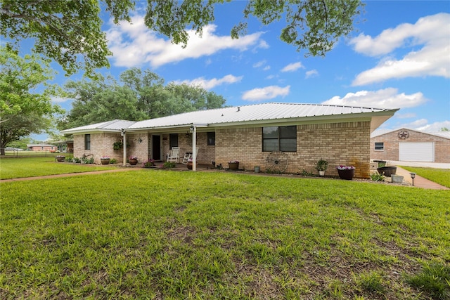 ranch-style house with brick siding and a front lawn