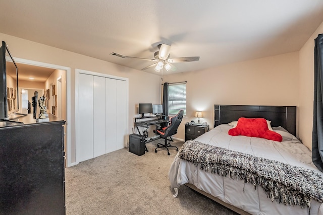 bedroom featuring ceiling fan, carpet, a closet, and visible vents