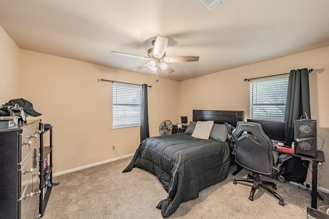 bedroom with carpet floors, multiple windows, baseboards, and visible vents