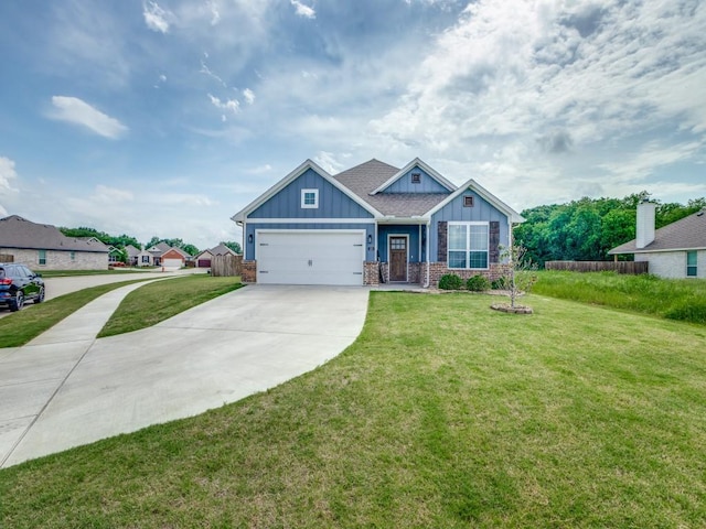 craftsman inspired home with a garage, fence, a front yard, board and batten siding, and concrete driveway