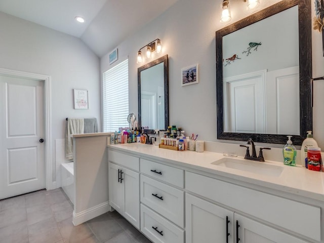 full bath with a sink, tile patterned flooring, double vanity, vaulted ceiling, and a bath