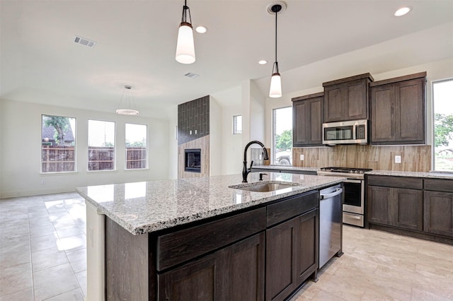 929 Ryed Ln, Fort Worth, TX 76120 - kitchen featuring a sink, appliances with stainless steel finishes, a wealth of natural light, and visible vents