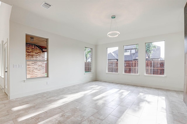 929 Ryed Ln, Fort Worth, TX 76120 - empty room with visible vents, baseboards, and a wealth of natural light