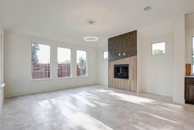 929 Ryed Ln, Fort Worth, TX 76120 - unfurnished living room with baseboards, a fireplace, and visible vents