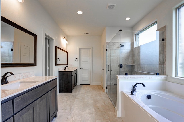 929 Ryed Ln, Fort Worth, TX 76120 - full bathroom featuring a sink, a stall shower, a bath, and a healthy amount of sunlight