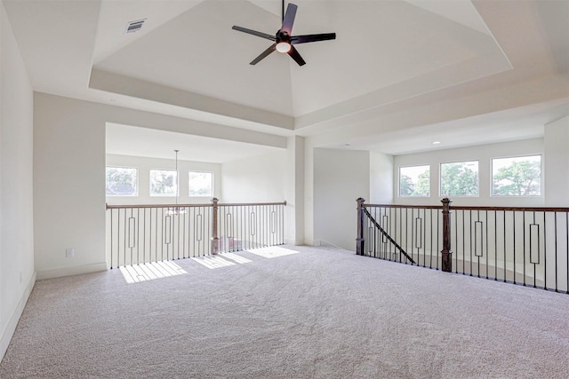 929 Ryed Ln, Fort Worth, TX 76120 - carpeted empty room featuring a ceiling fan, baseboards, visible vents, and a raised ceiling