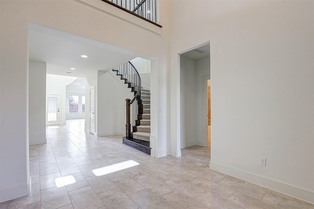 929 Ryed Ln, Fort Worth, TX 76120 - entryway with recessed lighting, baseboards, stairway, and a towering ceiling