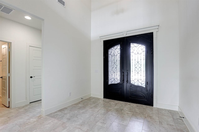 929 Ryed Ln, Fort Worth, TX 76120 - foyer with baseboards, visible vents, and french doors