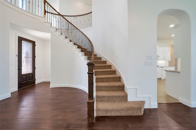 6917 Moody Ave, Frisco, TX 75035 - entryway featuring hardwood / wood-style floors, arched walkways, stairway, and recessed lighting