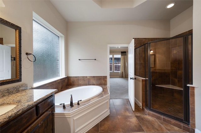 bathroom featuring vanity, recessed lighting, a stall shower, tile patterned floors, and a bath