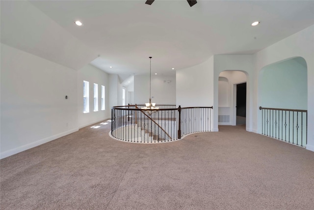 6917 Moody Ave, Frisco, TX 75035 - unfurnished room with carpet, a chandelier, recessed lighting, and arched walkways
