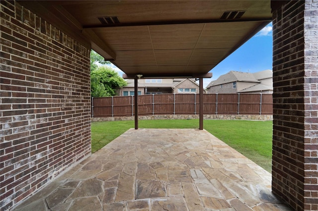 view of patio / terrace featuring a fenced backyard and visible vents