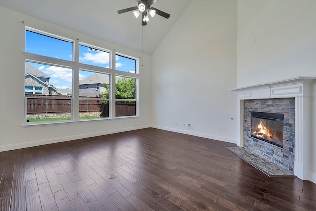 6917 Moody Ave, Frisco, TX 75035 - unfurnished living room featuring high vaulted ceiling, ceiling fan, dark wood-type flooring, and a fireplace
