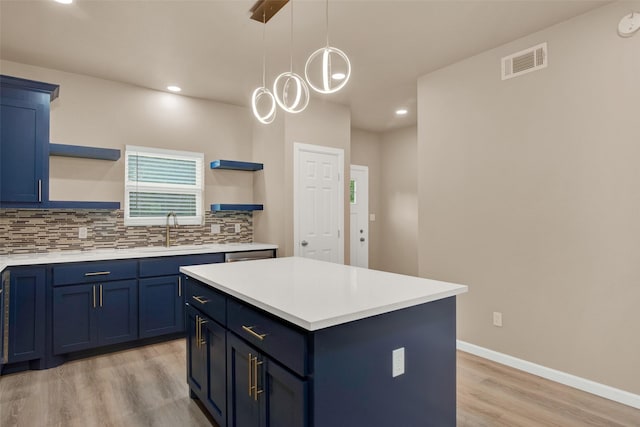 703 S Montgomery St, Sherman, TX 75090 - kitchen with open shelves, blue cabinetry, light wood-type flooring, light countertops, and recessed lighting