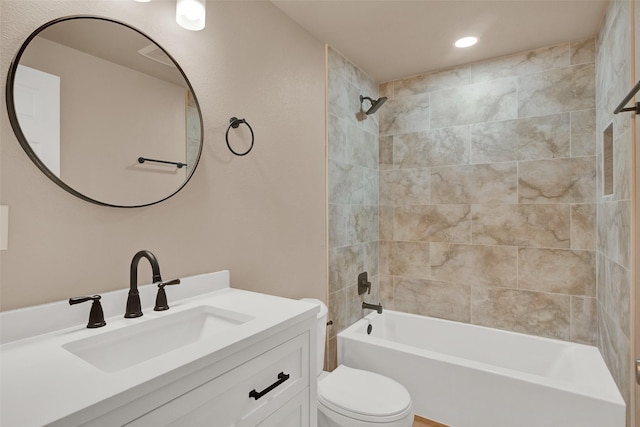 703 S Montgomery St, Sherman, TX 75090 - bathroom featuring toilet, vanity,  shower combination, and recessed lighting
