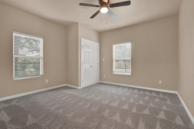 703 S Montgomery St, Sherman, TX 75090 - unfurnished bedroom featuring carpet flooring, baseboards, a ceiling fan, and a closet
