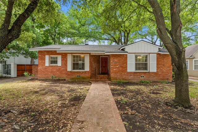 ranch-style house with brick siding, fence, and crawl space