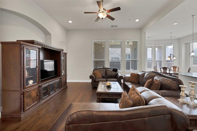 living area featuring ceiling fan, visible vents, baseboards, recessed lighting, and hardwood / wood-style floors