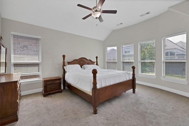 bedroom with visible vents, baseboards, light colored carpet, a ceiling fan, and vaulted ceiling