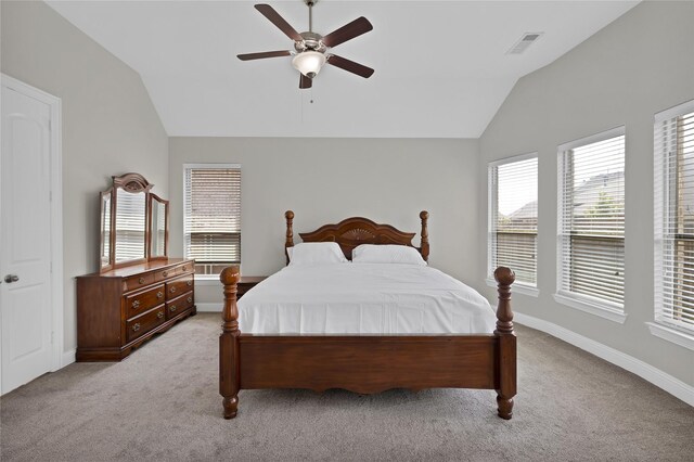 bedroom featuring visible vents, baseboards, lofted ceiling, and light colored carpet
