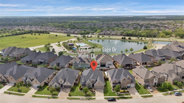 bird's eye view featuring a residential view and a water view