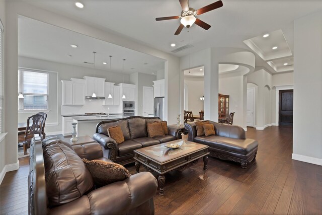 living area featuring visible vents, recessed lighting, ceiling fan, and dark wood-style floors