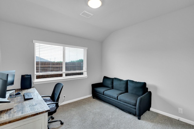 carpeted office featuring baseboards, visible vents, and lofted ceiling