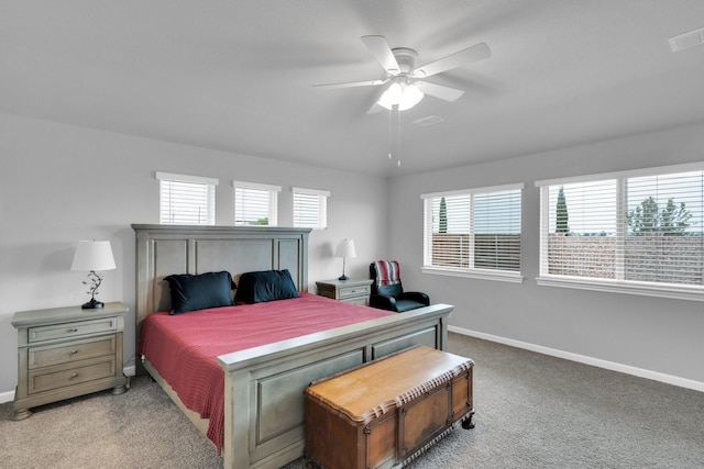 carpeted bedroom with baseboards, ceiling fan, and visible vents