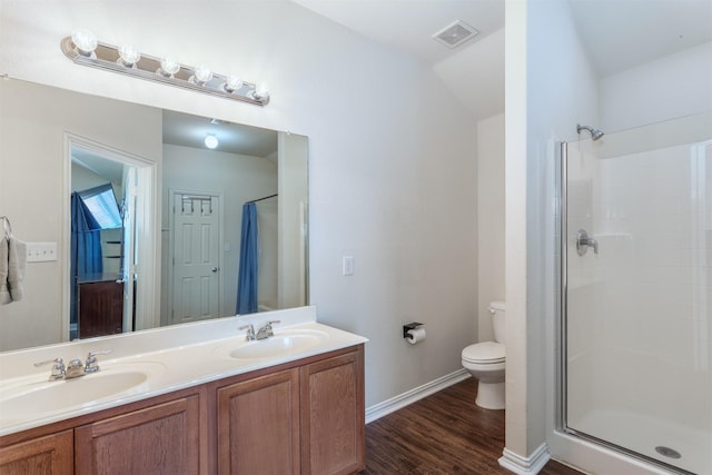 735 Cedar Cove Dr, Princeton, TX 75407 - full bathroom featuring toilet, a shower stall, wood finished floors, double vanity, and baseboards