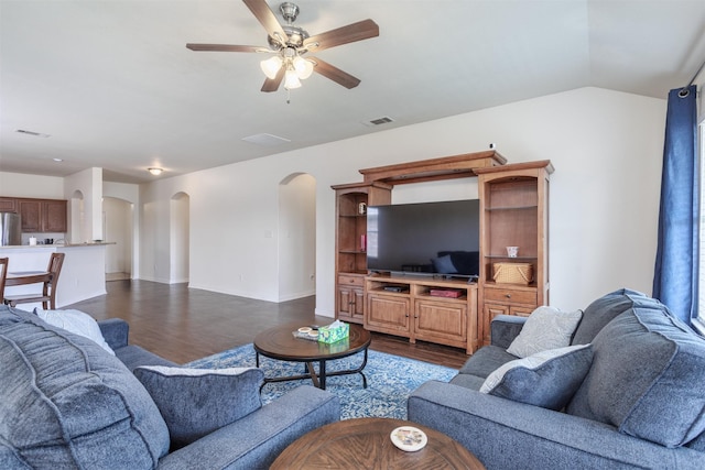 735 Cedar Cove Dr, Princeton, TX 75407 - living room featuring arched walkways, dark wood-style flooring, a ceiling fan, baseboards, and vaulted ceiling