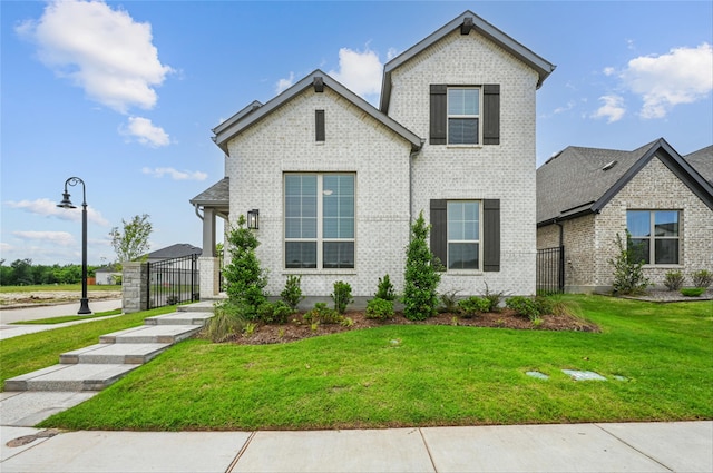 1000 Tulip Pl, Crowley, TX 76036 - view of front of property featuring brick siding and a gate