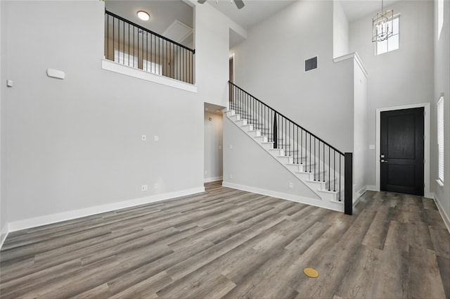 1000 Tulip Pl, Crowley, TX 76036 - foyer entrance with a towering ceiling, stairs, wood finished floors, baseboards, and a ceiling fan