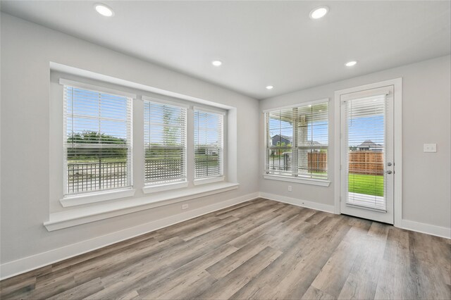 1000 Tulip Pl, Crowley, TX 76036 - empty room featuring baseboards, wood finished floors, and recessed lighting