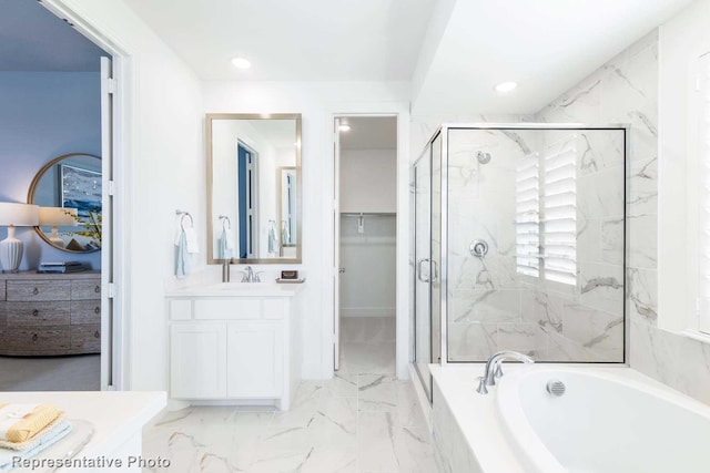 bathroom featuring vanity, a garden tub, a stall shower, and recessed lighting