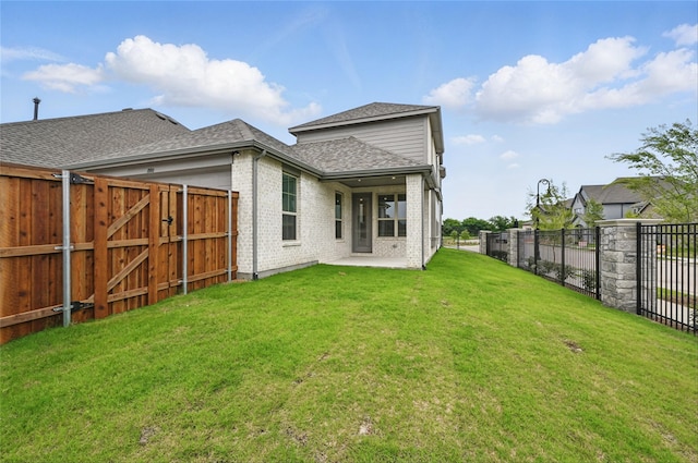1000 Tulip Pl, Crowley, TX 76036 - back of property with brick siding, roof with shingles, a patio, and a gate