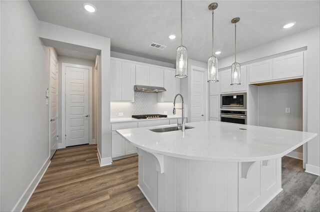 1000 Tulip Pl, Crowley, TX 76036 - kitchen featuring a sink, oven, stovetop, under cabinet range hood, and built in microwave