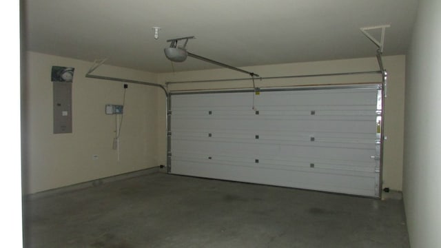 garage featuring a garage door opener and electric panel