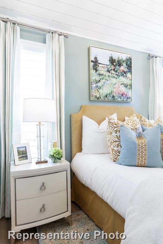 bedroom featuring multiple windows
