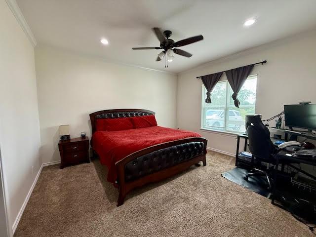 carpeted bedroom featuring crown molding, recessed lighting, baseboards, and ceiling fan