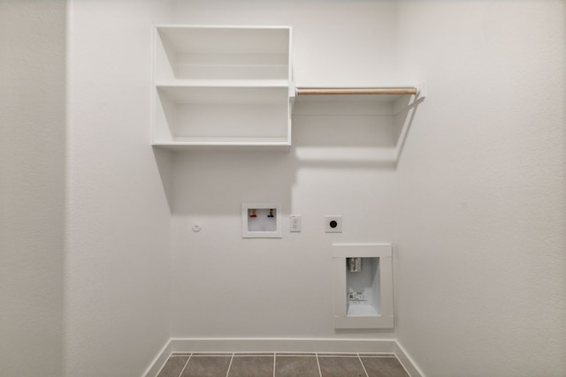 laundry room with laundry area, baseboards, hookup for a washing machine, gas dryer hookup, and hookup for an electric dryer