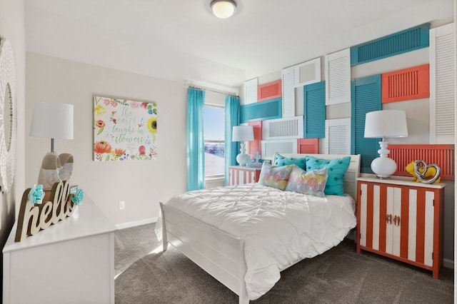 carpeted bedroom with baseboards