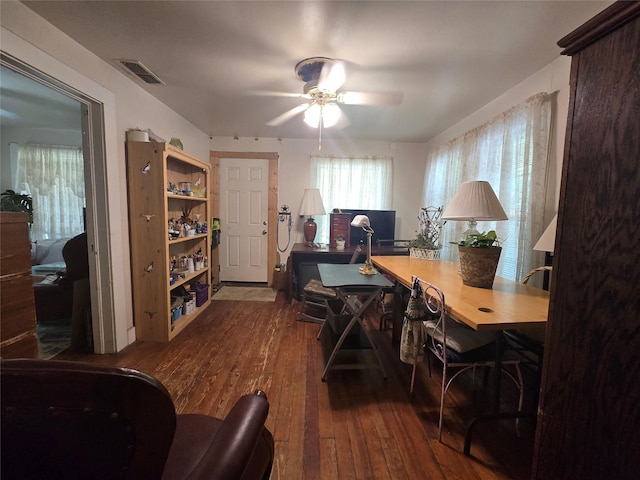 office space featuring ceiling fan, wood-type flooring, and visible vents