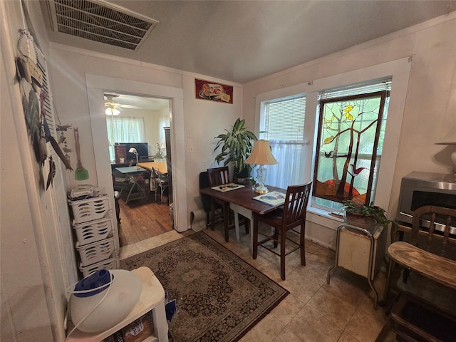 dining room with a ceiling fan and visible vents