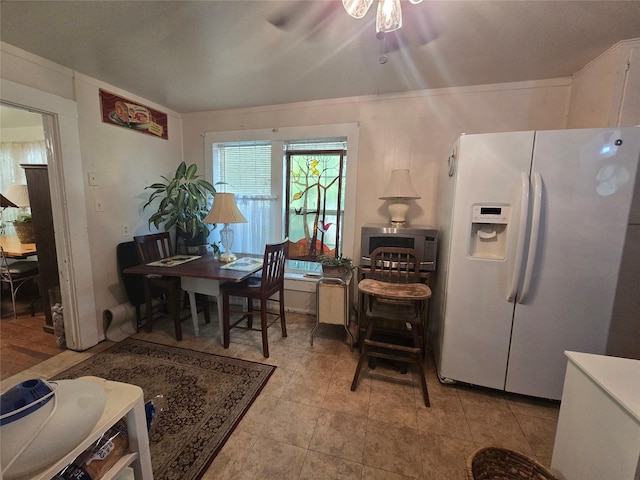 dining space featuring a ceiling fan