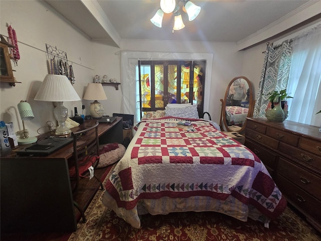 bedroom featuring access to exterior and ornamental molding