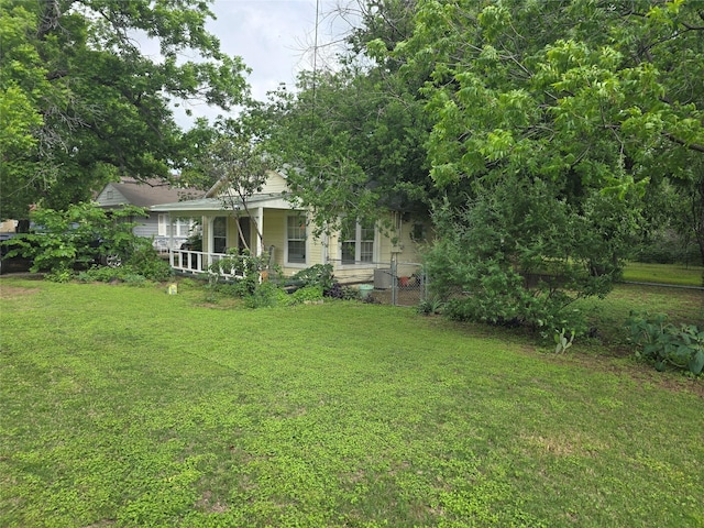 view of yard with covered porch