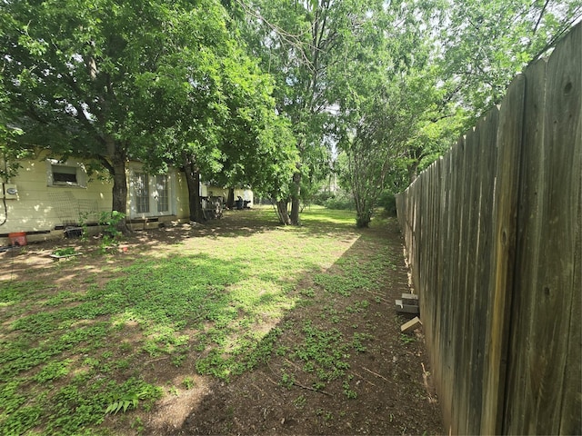 view of yard featuring fence