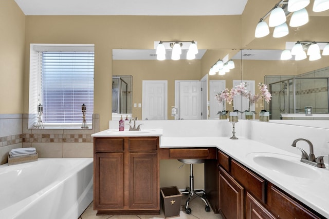 bathroom with a sink, double vanity, a stall shower, and a bath